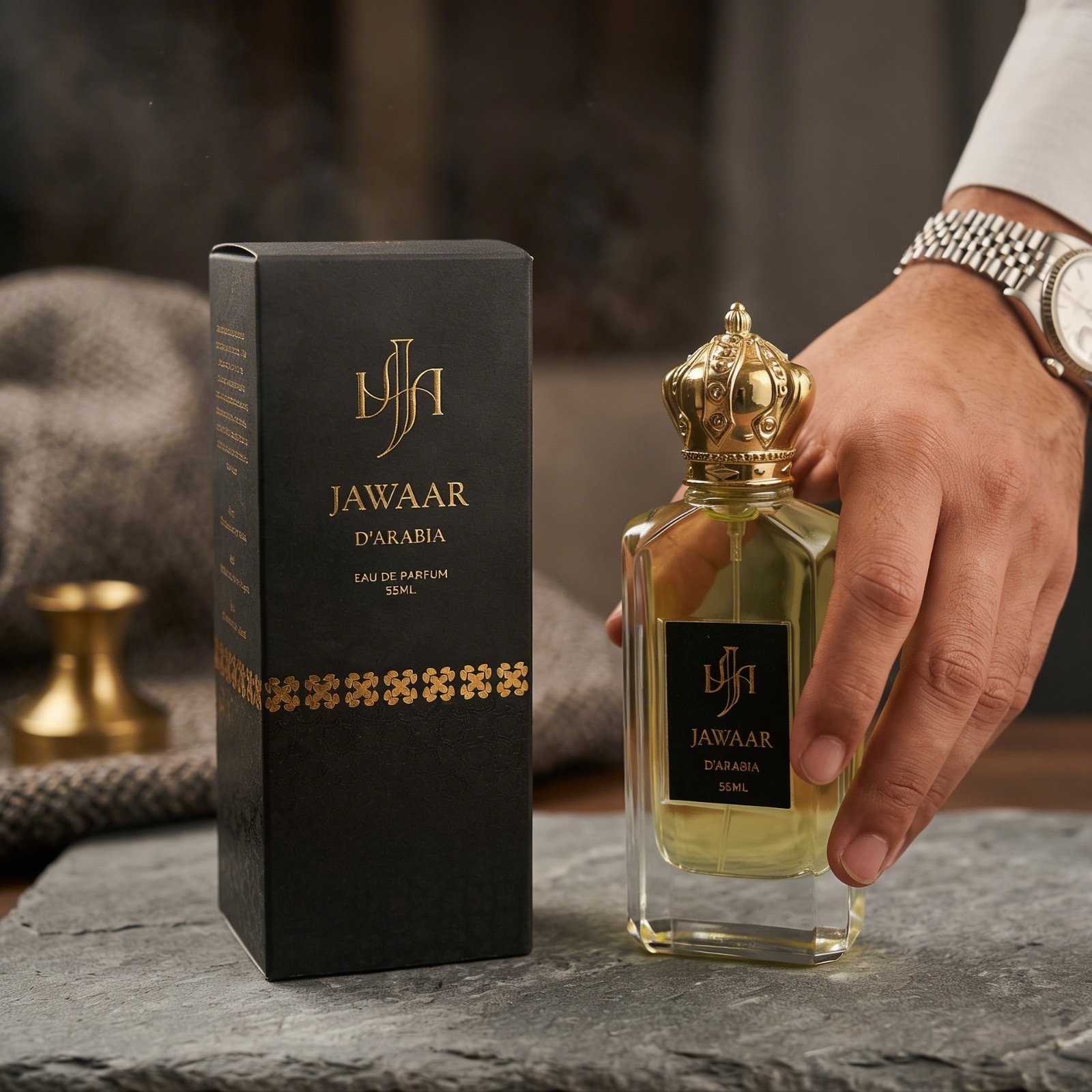 A hand placing the Jawaar d'Arabia bottle on stone
